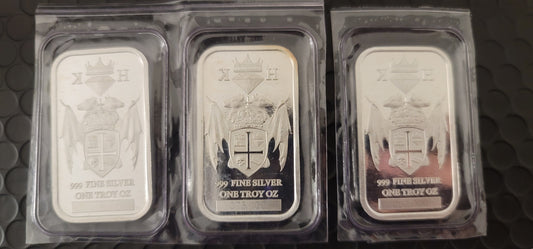 Three 2020 Kannibal Coat of Arms Transitional Reverse Bars in 1 oz .999 fine silver, shown sealed in protective sleeves
