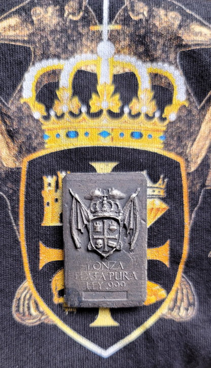Coat of Arms Relic Bar in 1 oz .999 fine silver displayed over Kannibal Hektor coat of arms artwork