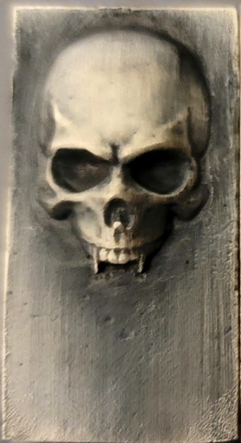 2025 Kannibal Skull Bar in antique finish, 1 oz .999 fine silver, front view with raised skull design