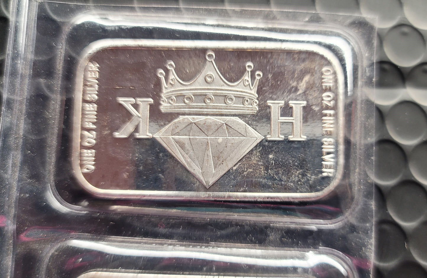 Close-up of 2020 Kannibal Coat of Arms Transitional Reverse Bar showing crowned diamond KH mark and one troy oz fine silver inscriptions
