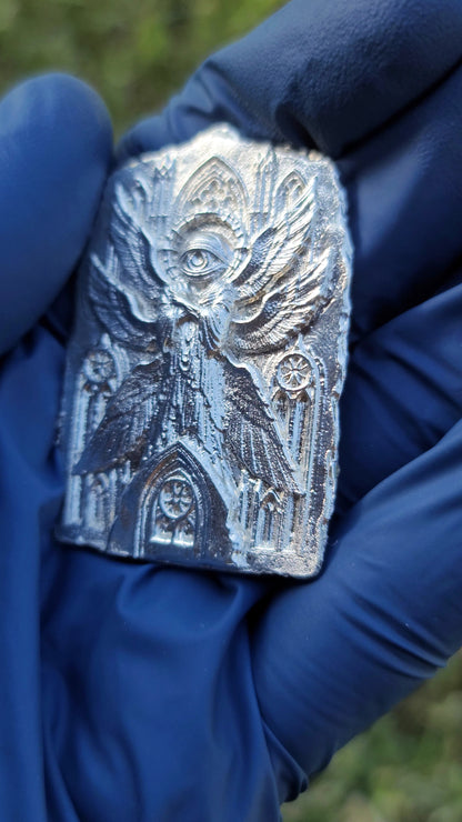 Side view showing the shallow relief of The Eternal Vigil silver work.