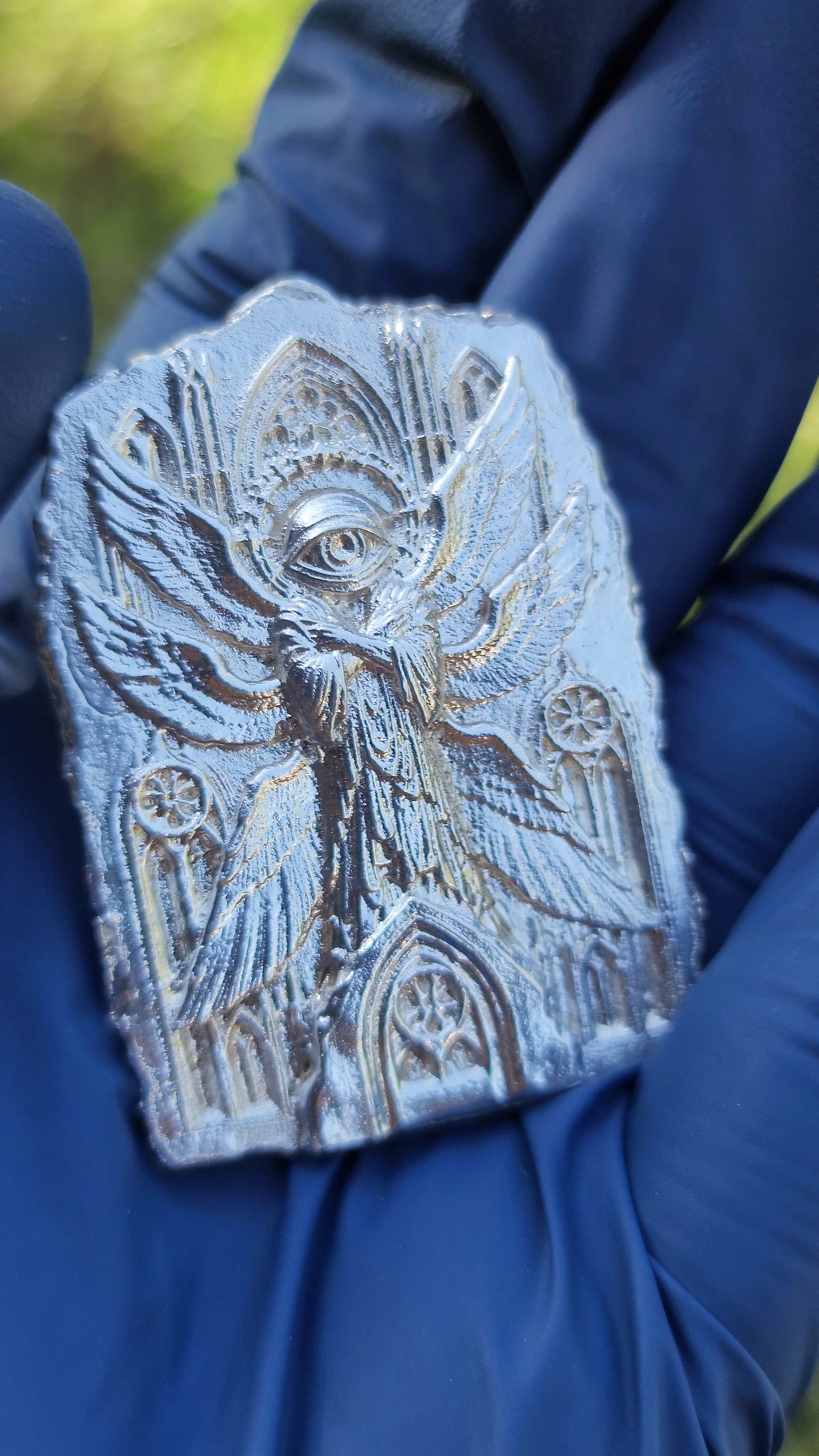 Side detail of The Eternal Vigil hand-cast .999 fine silver relief.