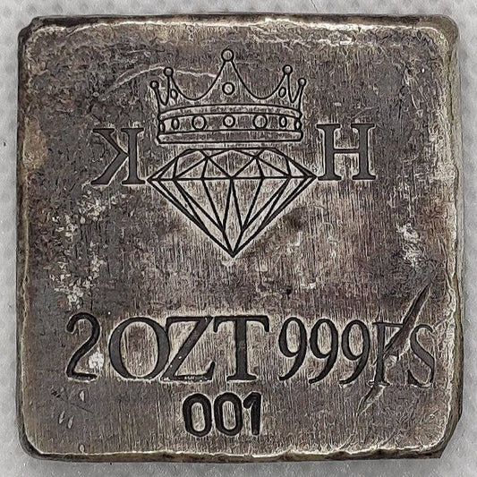 Reverse of Kannibal Hektor Coat of Arms Crest in .999 fine silver, showing KH maker’s mark, 2 oz weight, purity, and serial number