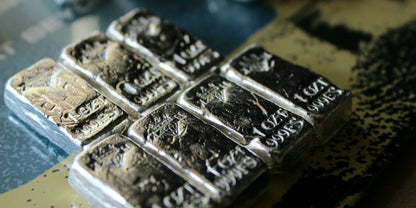 Angled group of Kannibal Hektor Basic Bars, hand-poured 1 oz .999 fine silver bars with crowned diamond KH maker’s marks