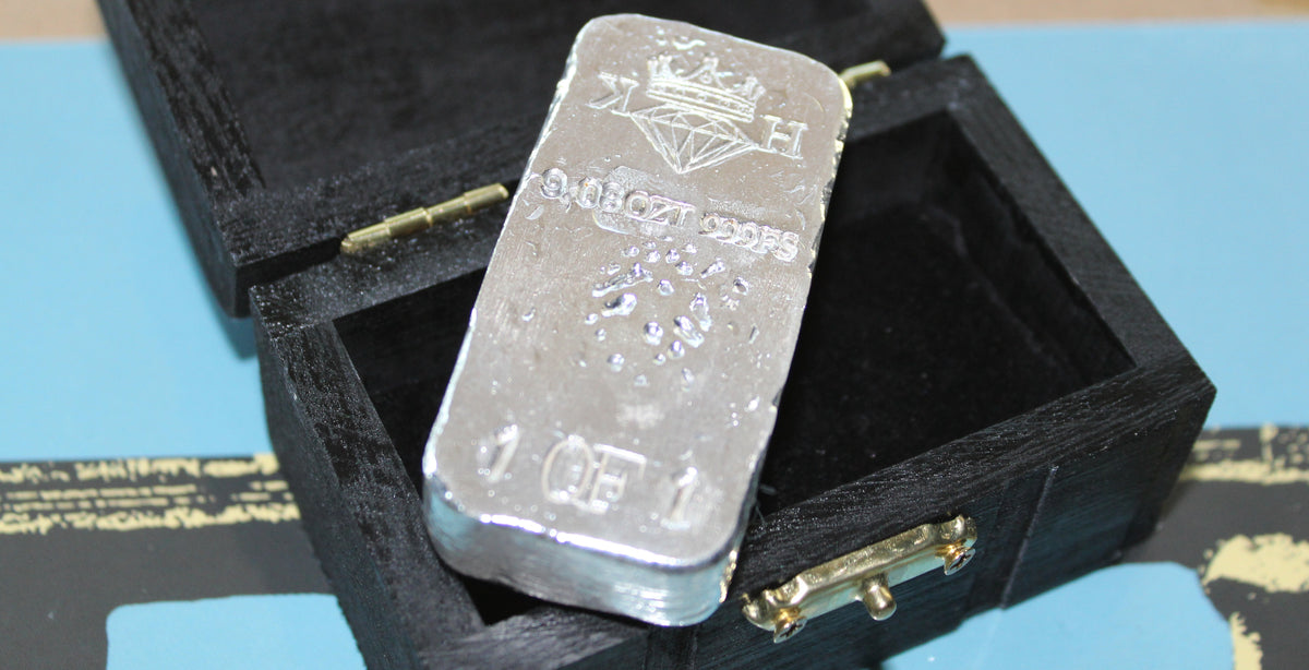 Reverse of Partial Coat of Arms Crest Bar in .999 fine silver, showing crowned diamond KH maker’s mark, 9.08 oz stamp, and 1 of 1 marking beside custom presentation box