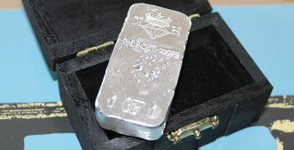 Reverse of Partial Coat of Arms Crest Bar in .999 fine silver, showing crowned diamond KH maker’s mark, 9.08 oz stamp, and 1 of 1 marking beside custom presentation box