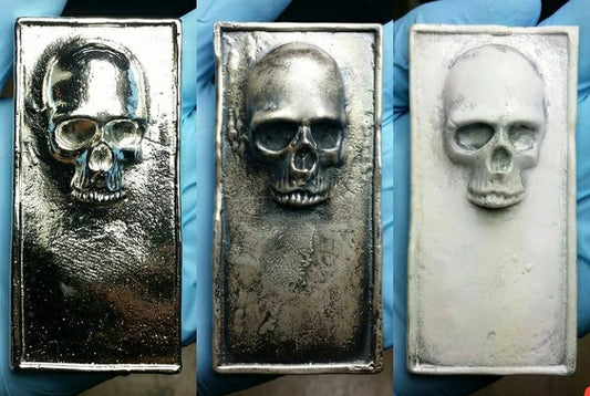 Three 2016 Kannibal Skull Bars in 10 oz .999 fine silver shown side by side in polished, antique, and matte finishes