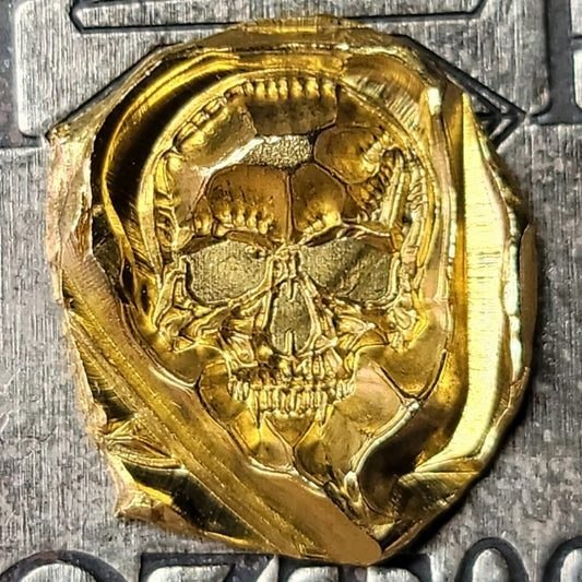 Kannibal Crest Gold Fractional, one-of-one 2.7 gram .999 fine gold piece with raised vampiric skull design