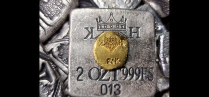 Reverse of Kannibal Crest Gold Fractional, 2.7 gram .999 fine gold piece showing crowned diamond KH maker’s mark and 24K stamp